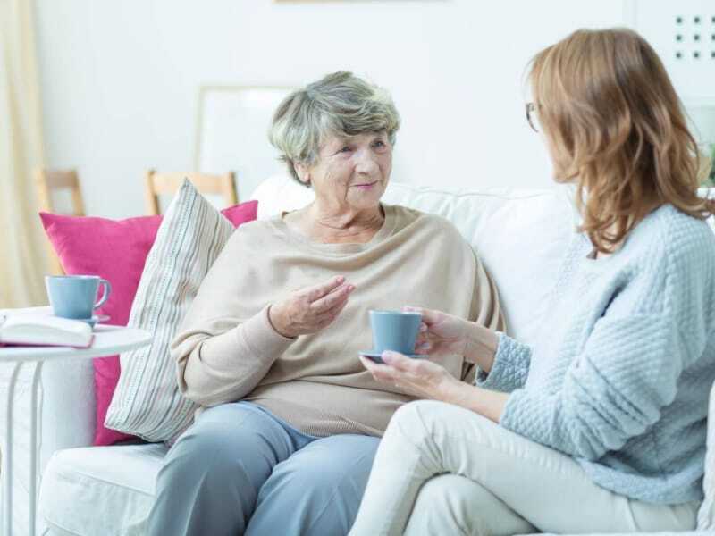 women chatting over coffee